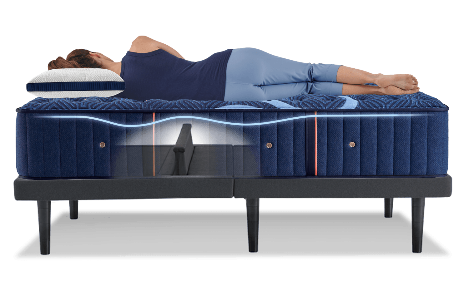 Woman sleeping on a mattress with lumbar support bar visible
