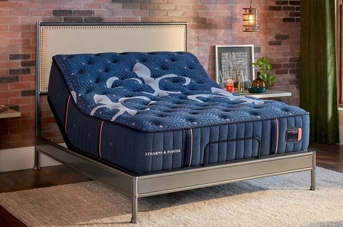 Lux Estate Mattress in a styled room raised on a base